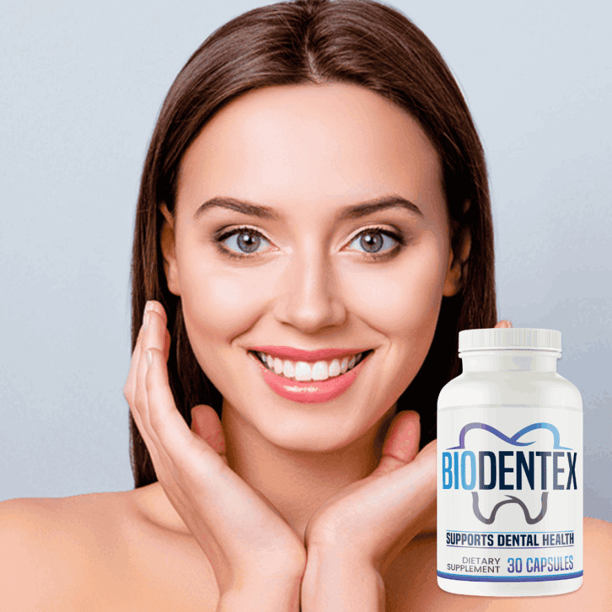 Person smiling while holding a bottle of Biodentex